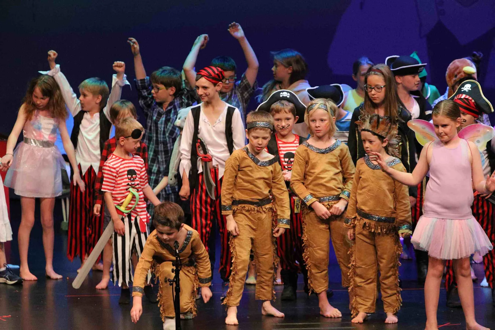 Carra students in costume on stage during the school concert
