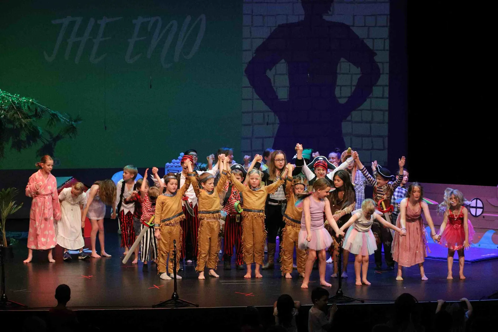 The full cast of Carra students taking a bow at the end of the school concert